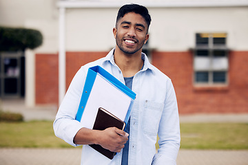 Image showing Happy, college and portrait of a man with books on campus for education, learning and studying. Smile, notebook and a student standing at university for scholarship, knowledge and school exam