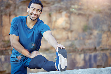 Image showing Portrait, sports and stretching with a man runner outdoor in the mountains for a cardio or endurance workout. Exercise, fitness and smile with a young male athlete getting ready for a run in nature