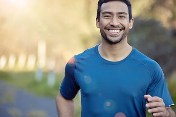 Image showing Man, smile in portrait and running outdoor, fitness and cardio with marathon, sports and athlete in nature. Asian male runner, happy with bokeh, exercise and training for race with mockup space