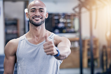 Image showing Thank you, portrait of man and with thumbs up at the gym with a lens flare. Success or motivation, agreement or health wellness and male athlete happy for support workout or fitness training