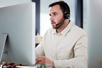 Image showing Customer service, man with a headset and computer at desk of his modern office workplace. Telemarketing or online communication, support or crm and male call center agent at his workstation.