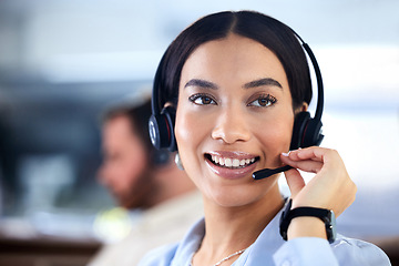 Image showing Customer service, woman with a headset and at her desk in a office at her workplace. Consultant or telemarketing, support or online communication and female call center agent smile at workstation