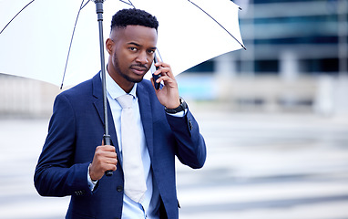 Image showing African business man, phone call and umbrella in portrait, street and communication on walk, travel and winter. Black businessman, smartphone and rain in urban metro, cbd and contact for taxi in road