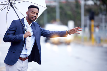 Image showing African business, man and transport with wave, taxi or bus in metro street with umbrella in winter rain. Black businessman, city and road for transportation, travel and stop with hand, sign or call