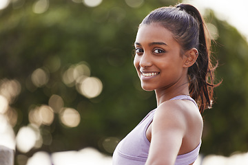 Image showing Woman, smile portrait and fitness outdoor of a Indian female person in park for exercise. Workout, mockup and sport of a runner athlete in nature for health, training and wellness with happiness