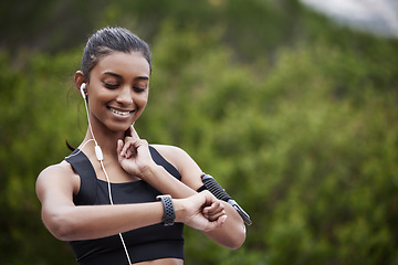 Image showing Woman, heart rate check and fitness in a park outdoor with happiness from exercise goal on time. Nature, mockup and female person with a watch monitoring sports, training and workout target on run