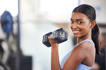 Image showing Portrait of happy woman in gym, dumbbell and mockup for weightlifting, power and muscle at sports club. Balance, fitness and fit female bodybuilder with weights, smile and training with health goals.