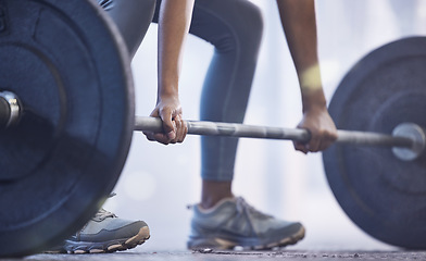 Image showing Gym, woman with barbell for weightlifting and fitness, power and muscle with closeup on hands at sports club. Challenge, zoom and strong female bodybuilder with weights and training with health goals