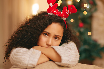 Image showing Portrait, sad woman and depression on Christmas in home with anxiety, worry and emotional crisis. Face of lonely female person feeling unhappy, bored and disappointed in festive holiday with headband