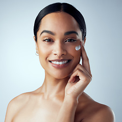 Image showing Skincare, face cream and woman in studio for dermatology, wellness or hydration on grey background. Portrait, sunscreen and lady model relax with collagen, mask or lotion, beauty or anti aging facial