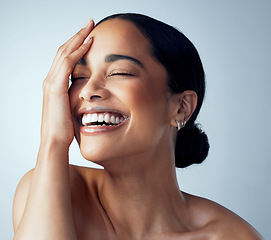 Image showing Hand, skincare and and happy woman in studio for body care, self love and natural cosmetic on grey background. Smile, dermatology and female model relax with luxury wellness, beauty and glowing skin