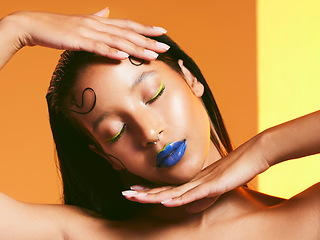 Image showing Makeup, neon cosmetics and face of woman in studio for cosmetics, eye shadow and beauty salon. Creative aesthetic, cosmetology and female person with blue lipstick for glamour, luxury style and glow