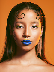 Image showing Makeup, cosmetic art and portrait of woman in studio for cosmetics, eye shadow and beauty. Aesthetic, creative cosmetology and face of female person with blue lipstick for glamour, fashion and style