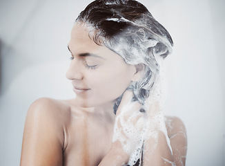 Image showing Shower, woman shampoo and hair wash for wellness, care and hygiene in a bathroom. Home, morning routine and cleaning with water and conditioner for beauty grooming in a house with person in steam