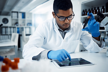 Image showing Science, blood sample and man on tablet in laboratory for medical analysis, research and online report. Healthcare, pharmaceutical and male scientist on digital tech for medicine, dna or test results