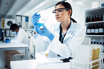 Image showing Science, research and woman scientist in laboratory with medical, sample and analysis. Healthcare, medicine and lady expert in lab with liquid for vaccine, cure or futuristic, innovation or solution