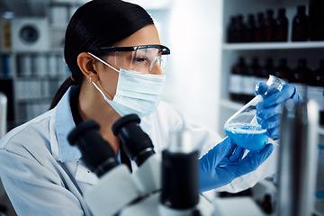 Image showing Woman, scientist and analysis of chemical liquid, glass beaker and science chemistry experiment in lab. Female doctor with mask, gloves and study fluid, scientific innovation and medical research