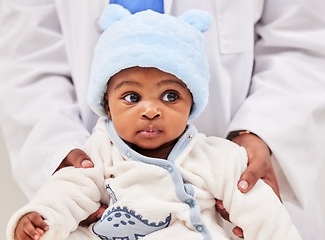 Image showing African, little baby and health checkup with specialist or paediatrician with infant or healthcare clinic and medical wellness. Child patient, toddler and expert with kid in doctors room or hospital