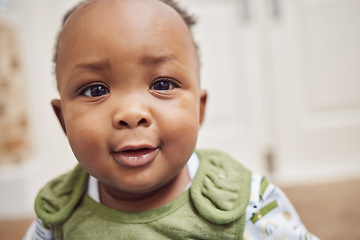 Image showing Face, baby and black child in home, cute or enjoying time alone in South Africa. African newborn, children and portrait of toddler, kid and young infant with childhood development for growth in house