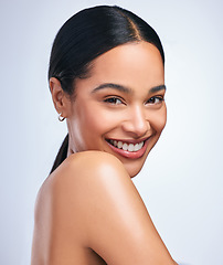 Image showing Woman, skincare and beauty in studio portrait with smile, happiness or natural glow on skin by white background. Girl, model and happy for makeup, cosmetics or youth with wellness, aesthetic or shine