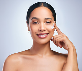 Image showing Beauty cream, woman and portrait of skincare with dermatology and face cleaning. Wellness, lotion and young female model smile with skin glow product and treatment with care and moisturizer in studio