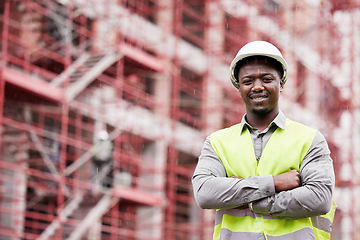 Image showing Portrait of proud black man engineer, construction site and mockup with scaffolding in city, planning and safety. Smile, architect or project manager at building, urban engineering and arms crossed.