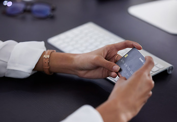 Image showing Business person, closeup and hands with a credit card, payment and shopping with banking details, online shopping and retail. Employee, woman and consultant with ecommerce, debit and transactions