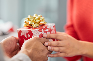 Image showing Christmas gift, celebrate and hands of couple of friends and workers with present and box. Holiday, event presents and giving a surprise package to a woman hand with care and love for celebration