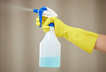 Image showing Hand, cleaning and spray for house work, home hygiene and spring clean in apartment with gloves. Hands, bottle spraying and washing product for housekeeper, maid and health protection from virus