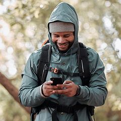 Image showing Black man, phone and smile for hiking communication, social media or chat in nature outdoors. Happy African male person or hiker smiling on mobile smartphone for trekking, travel or online location