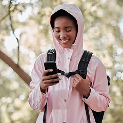 Image showing Black woman, phone and smile for hiking communication, social media or chatting in nature. Happy African female person or hiker smiling on mobile smartphone for trekking, travel or online location