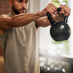 Image showing Fitness, muscle and man with kettle bell in gym for exercise, bodybuilder training and workout. Sports, motivation and serious male person lifting weights for wellness, healthy body and strength