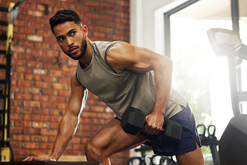 Image showing Exercise, fitness and man with dumbbell in gym for weightlifting, bodybuilder training and workout. Sports, strong muscles and serious male person lift weight for wellness, healthy body and strength