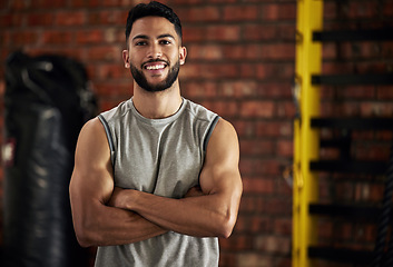 Image showing Gym, smile and portrait of man with arms crossed, fitness and happiness in mockup space. Exercise, workout and happy face of bodybuilder, personal trainer or sports club owner for health, training.