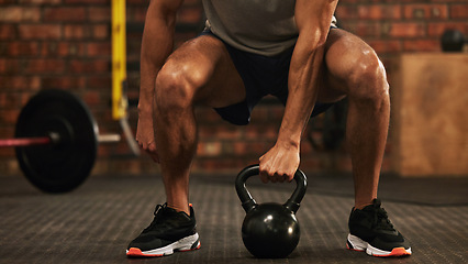 Image showing Sports, kettlebell and male athlete doing a workout in the gym for strength, health and motivation. Fitness, strong and closeup of a man doing an arm exercise with weights and squats in sport center.