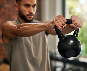 Image showing Fitness, training and man with kettle bell in gym for exercise, bodybuilder workout and muscle strength. Sports, motivation and serious male person lift weights for wellness, healthy body and cardio