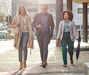 Image showing Business people in city, walking and travel with commute to work, happy corporate group with journey and outdoor. Professional, businessman and women walk in street with employees traveling together