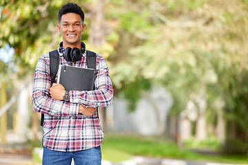 Image showing Happy, ready and portrait of a man on campus for education, learning and knowledge with mockup space. Smile, university and a young male student with books in a college park to start studying