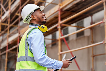 Image showing Architecture, inspection and checklist with black man on construction site for engineering, planning and building. Designer, safety and project management with contractor in city for infrastructure