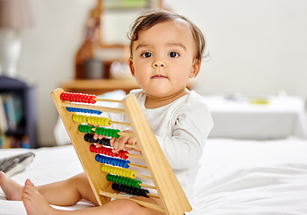 Image showing Abacus, bed and portrait of baby with toy for learning, child development and motor skills. Family home, newborn and face of adorable child with educational toys, counting beads and fun in bedroom