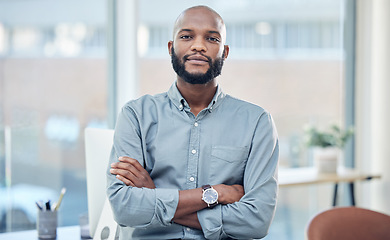 Image showing Confidence, crossed arms and portrait of a businessman in the office with leadership and vision. Serious, career and professional African male hr manager sitting with a positive mindset in workplace.