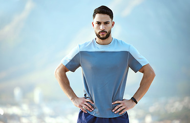 Image showing Fitness, serious man and outdoor for a run or workout with hands on hip for motivation. Portrait of male athlete person or runner for cardio training, running or exercise for focus on wellness goals