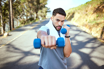 Image showing Man, dumbbell and punch in nature fitness for exercise, workout or training in the outdoors. Portrait of fit, active and sporty male person punching with weights in healthy outdoor cardio endurance