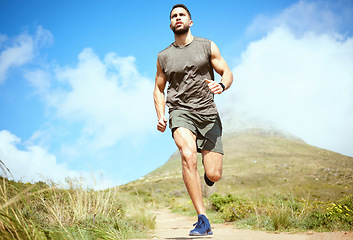 Image showing Man, fitness and running on mountain for exercise, cardio workout or training in the nature outdoors. Male person, athlete or runner in sports outdoor run, hiking or trekking for healthy wellness