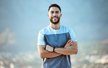 Image showing Fitness, man and outdoor for a run or workout with a smile and arms crossed for motivation. Portrait of a male athlete person in nature for cardio training, running or health and wellness goals