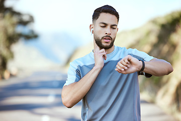 Image showing Man, fitness and running with watch for pulse, heart rate or checking performance after cardio workout in nature. Male person, athlete or runner looking at wristwatch during outdoor run or exercise