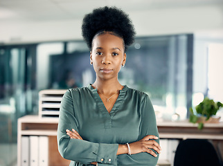 Image showing Serious, crossed arms and portrait of a businesswoman in the office with vision, leadership or ideas. Professional, corporate and young African female hr manager standing with pride in the workplace.