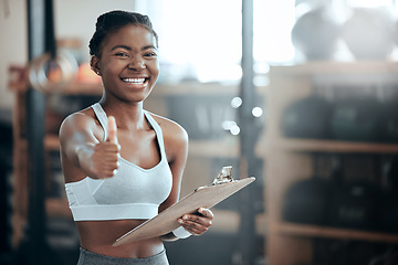 Image showing Thumbs up, personal trainer portrait or happy black woman at gym for workout, exercise or fitness training. Healthy sports girl, thumb up or proud coach smiling with yes hand sign, like or clipboard