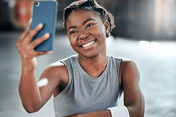 Image showing African woman, gym selfie and smile for fitness, workout or wellness on floor with social media app. Influencer girl, photography or blog for exercise, performance and health for lifestyle in club