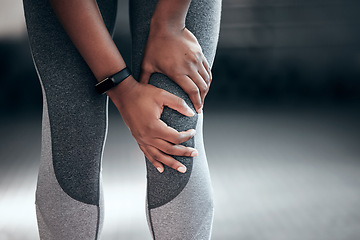 Image showing Fitness, workout and closeup of woman with knee pain, injury or accident during training in a gym. Sports, medical emergency and zoom of female athlete with a sprain muscle in her leg at sport center